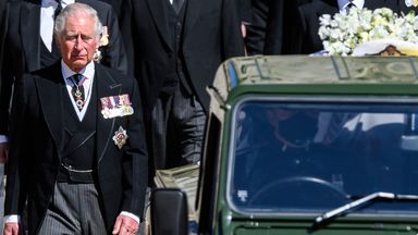 Prince Charles follows the coffin as it makes it's way past the Round Tower. Pic: AP